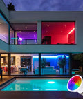 Modern home with Color Changing PAR16 LED Light Bulbs With Remote Control Dope RGB Colors, highlighting interior and pool area