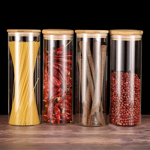 Heavy Glass Coffee Canister 2200Ml Wide Mouth Airtight Food Storage Jar For Tea Sugar Beans And Nuts Gonna Keep Your Morning Brew Fresh Along Your Counter filled with pasta, dried chili, and spices.