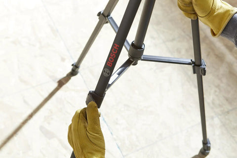 BT 150 Compact Tripod With Extendable Height For Line Lasers Point Lasers And Laser Distance Measures being adjusted on site
