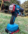 Heavy Duty Cordless Drill Driver With Ten Speed Torque Settings And Included Battery for smooth operation on grass.