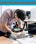 Man using Dope 15X Magnifying Glass Desk Lamp With Metal Base 360 Degree Rotatable Aluminum Arms for electronic repairs