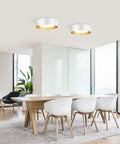 Round Modern LED Ceiling Light With Wood Metal And Acrylic Finish in a dining room, sleek contemporary fixture above table