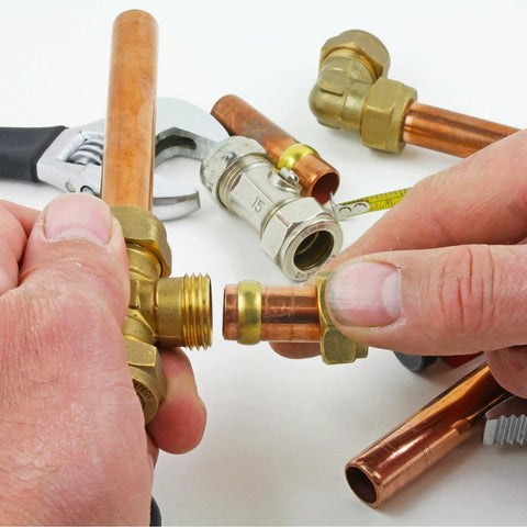 Close-up of hands assembling PATIKIL brass compression ferrules for 1/4 in copper tube, 20-pack kit.