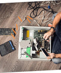 Technician using Six Piece Soldering Assist Set Desoldering Pump And Wick Kit For PCBs on computer components