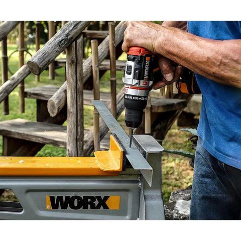 Brushless Cordless Hammer Drill With Two 20 Volt Batteries And Active Hammer Action For Concrete Masonry And Wood That Straight Up Crushes Every DIY Job And Handles Tough Home Projects Like A Boss drilling into metal guide with a hand on the drill.
