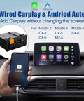 Mazda CarPlay And Android Auto Retrofit Kit Slick Plug And Play Upgrade For MZD Connect System displayed in a car dashboard