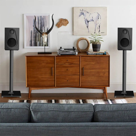 Universal Floor Speaker Stands For Surround Sound Up To 22 Lbs With 27.56 Inch Height And 45 Degree Adjustable Top Plate in a living room