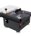 Badass Mini Table Saw With Slick Adjustable Speed And Precision Tilt Angles For Rapid Wood Cutting Sanding Engraving And Drilling on a black compact unit with clear surface.