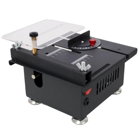 Badass Mini Table Saw With Slick Adjustable Speed And Precision Tilt Angles For Rapid Wood Cutting Sanding Engraving And Drilling on a black compact unit with clear surface.