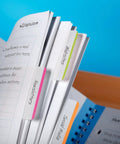Sticky Tabs 2 In By 1.5 In Book Markers in Assorted Bright Colors highlighting sections of a notebook for easy organization.