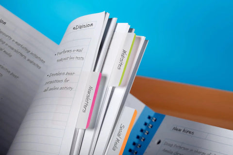 Sticky Tabs 2 In By 1.5 In Book Markers in Assorted Bright Colors highlighting sections of a notebook for easy organization.