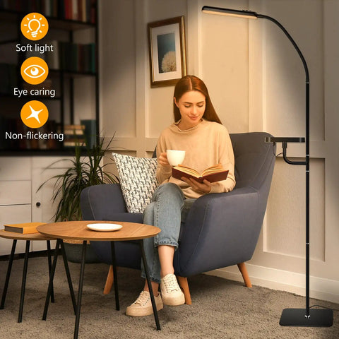 Smart LED Floor Lamp With Wireless Charger, 12W Dimmable Standing Lamp next to woman reading in living room chair
