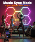 RGB Hexagon Garage Lights With Music Sync, LED Hexagon Wall Panels For Gaming Room And Studio installed on wall with people dancing