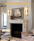 Natural Spanish Alabaster Wall Sconce, 19.7" High Marble Wall Sconces, G9 illuminating a modern living room with a marble fireplace.