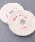 Two Piece White Cloth Polishing Wheel Set for Jewelry and Aluminum Projects, 6-inch, on a textured grey surface