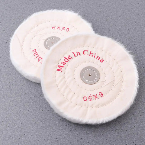 Two Piece White Cloth Polishing Wheel Set for Jewelry and Aluminum Projects, 6-inch, on a textured grey surface