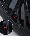 4 Pack Aluminum Alloy Tire Valve Caps For Cars Trucks SUVs And Motorcycles Red Universal Dustproof Valve Stem Caps With Rubber Gasket For Leak Free Performance shown on a black tire rim