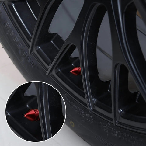 4 Pack Aluminum Alloy Tire Valve Caps For Cars Trucks SUVs And Motorcycles Red Universal Dustproof Valve Stem Caps With Rubber Gasket For Leak Free Performance shown on a black tire rim