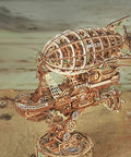 3D Wooden Airship Puzzle For Adults, Steampunk Vibe Fantasy Model Kit with intricate mortise and tenon construction displayed on sand