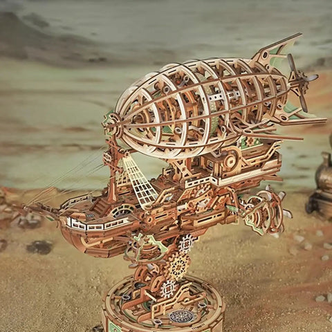 3D Wooden Airship Puzzle For Adults, Steampunk Vibe Fantasy Model Kit with intricate mortise and tenon construction displayed on sand