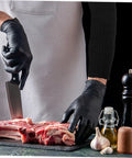 2 Pack Cut Resistant Arm Sleeves Hella Tough Pe Guard Top Shelf Protection For Gardening Welding Metalwork And Crafting Keep Your Forearms Beat Proof With Ergonomic Fit And Lightweight Portability For Pros And DIYers, black sleeves worn while cutting meat.