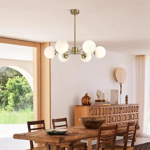 Gold Sputnik Chandelier With Six Milk Glass Globes Brass Flush Mount Ceiling Light in a dining room setting