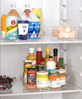 4 Pack Lazy Susan Organizer Set With Two 12 Inch High Edge Turntables in refrigerator holding drinks and condiments
