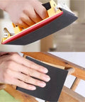 Hand using wet dry sandpaper on a curved surface for polishing wood with precision from the Ultimate Wet Dry Sandpaper Assortment.