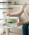 Top Tier Ready Slick Desktop Aquarium Kit With Smart App Control And Built In Auto Feeder 1.3 Gallon Small Fish Tank on desk.