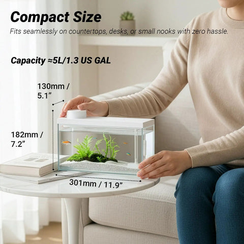 Top Tier Ready Slick Desktop Aquarium Kit With Smart App Control And Built In Auto Feeder 1.3 Gallon Small Fish Tank on desk.