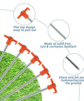 Heavy Duty Tent Stakes 40 Pack, 10 Inch Galvanized Metal Tent Pegs For Outdoor Camping with orange top and sharp ends on grass
