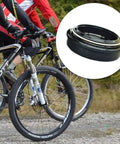Front Fork Dust Seal Kit For Mountain Bikes, Oil Seal And Dust Wiper For 28.6mm To 36mm Suspension Forks shown beside mountain bikes