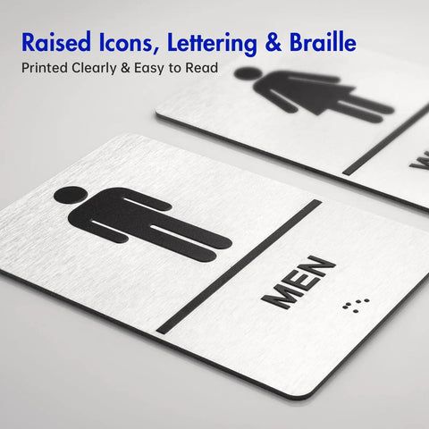 Two Piece ADA Restroom Signs For Business Men's And Women's Bathroom Sign Set in Silver Brushed Aluminum with raised Braille, angle view.