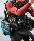 Person wearing Ultra Compact Pro Octopus For Scuba Diving with Pneumatically Balanced Breathing Venturi Switch, visible yellow hose