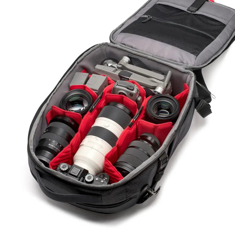 Interior of Pro Light Backloader S Professional Camera Backpack with gear showing beefed up padded dividers and dual tripod attachment.
