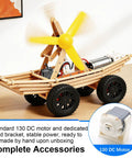 Six Piece DC Motor Kit for DIY Science Projects 3 to 12 Volt 25000 RPM Includes 9 Volt Battery Clip Shaft Propeller Two AA Battery Holders and Plastic Wheels Hands On Electronics Learning featuring a wooden car model with attached motor and spinning yellow propeller, displayed on a table.