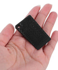 Adjustable Furniture Leveling Shims And No Slip Appliance Stability Pads in hand, black textured pad for home use.