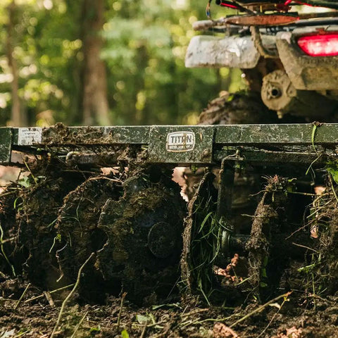 Tow Behind Notched Disc Harrow Attachment for ATV UTV 4 ft wide with 2 in towball hitch, 14 in concave discs in use on soil