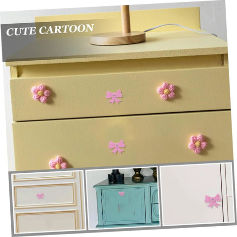 Super Dope Pink Bow Cabinet Pulls Pack Eight Piece Alloy Dresser Knobs For Girls Bedroom Refresh, mounted on yellow drawers.
