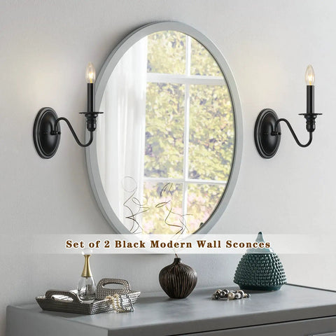 Black Wall Sconces Set Of Two Modern Farmhouse Candle Wall Lamps with matte finish flanking a round mirror in living room.