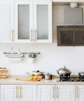 Modern kitchen with Champagne Bronze Cabinet Pulls 10 Pack 5 Inch Center To Center 6.6 Inch Overall Length on white cabinets.