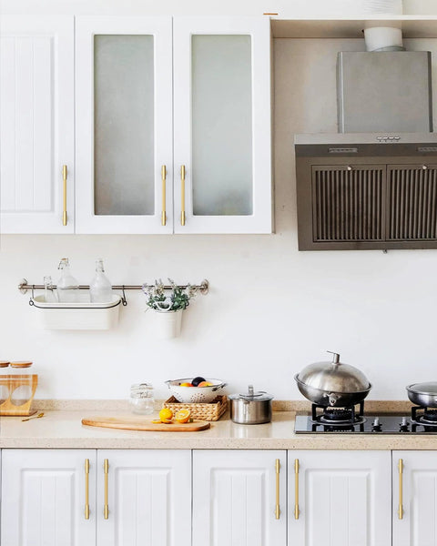 Modern kitchen with Champagne Bronze Cabinet Pulls 10 Pack 5 Inch Center To Center 6.6 Inch Overall Length on white cabinets.