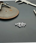 Close-up of silver split pins from 100 Piece Doll Joints Puppet Craft Kit For Kids And Grownups Scrapbook Fasteners And Split Pins For DIY Projects