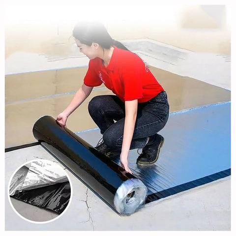 Heavy Duty Bitumen Sealing Tape With Reflective Aluminum Foil Backing being unrolled for roof repairs by a user.