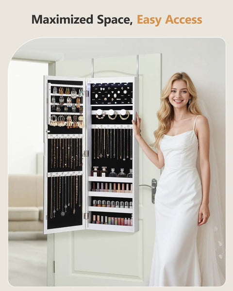 Woman opening a Six LED Mirror Jewelry Cabinet With Large Capacity Lockable Armoire Door Or Wall Mounted Jewelry Organizer Built In Jewelry Storage White Finish Perfect Gift Idea displaying organized jewelry on a white door.