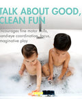 Two toddlers in a bathtub playing with Cogs Spinning Gear Bath Toys Set For Bathtub Navy And Yellow 5 Count Suction Toys.