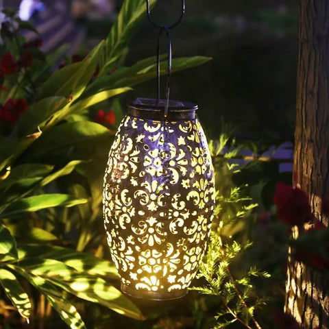 Two Pack Solar Lantern Lights For Hanging Or Table Outdoor Patio Garden Silver Finish Solar Powered Lights glowing at night
