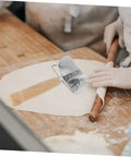 Knock Out Perfect Dumpling Wrappers Effortlessly With This Three Piece Stainless Steel Roller Set designed for quick shaping on dough.