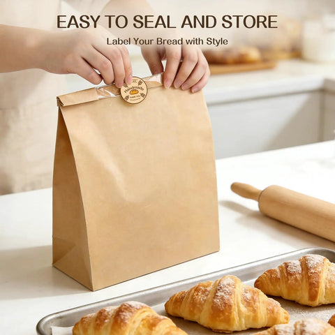 Person sealing a bread bag; 100 Pack Bread Bags With Clear Window And 120 Stickers For Homemade Bread Storage Sourdough