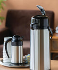 ECAL22S Eco Air Lever Airpot With Glass Vacuum Insulated Beverage Dispenser 2.2 Liter Thermal Coffee Carafe on table